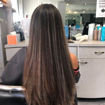 Long straight hair with dimensional caramel and honey highlights
