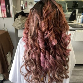 Rose gold and copper balayage on defined shiny ringlet curls