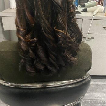 Full-bodied curls with rich brown and warm auburn tones